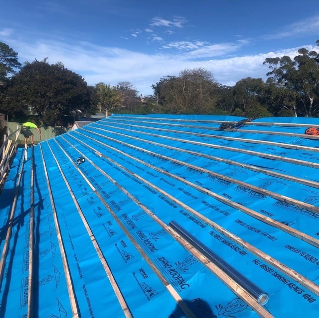 A photo showing waterproof sarking beneath a roof without its tiles