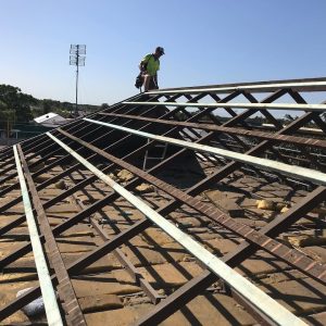 a roof without any tiles visible showing the wooden timber batten structure