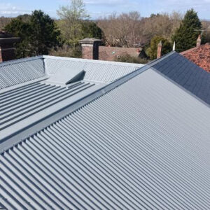 A photograph of a metal roof with a new metal roof cap.
